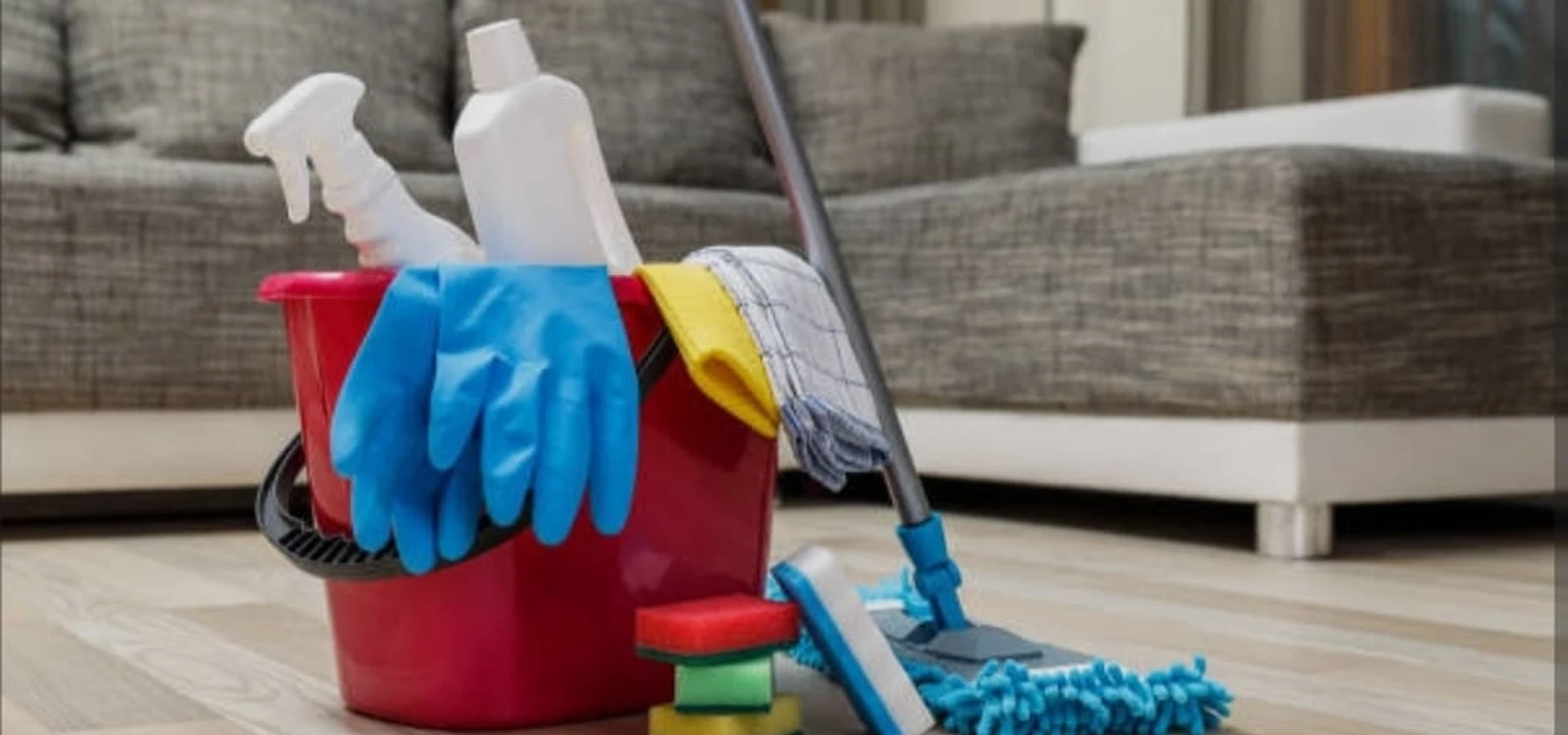 Professional cleaning supplies including bucket, mop, gloves and sponges ready for a move-out clean in Fraser Valley BC
